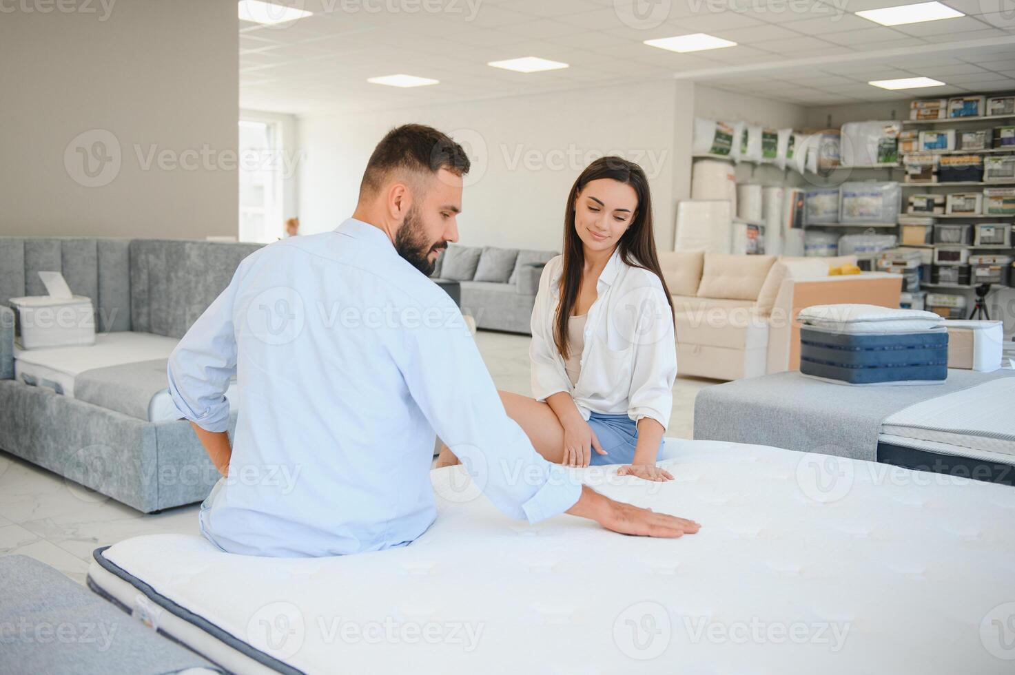 Woman with her husband at the furniture store showroom photo