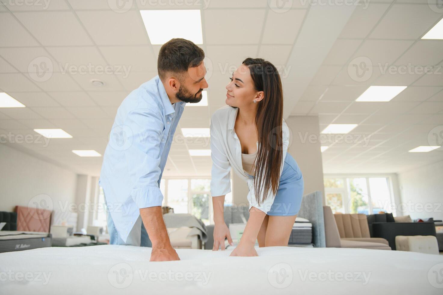 Woman with her husband at the furniture store showroom photo