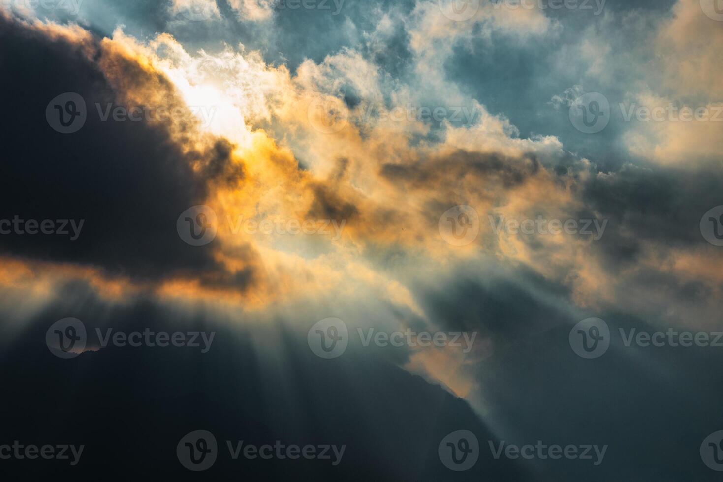 Divine rays of sun between the clouds photo