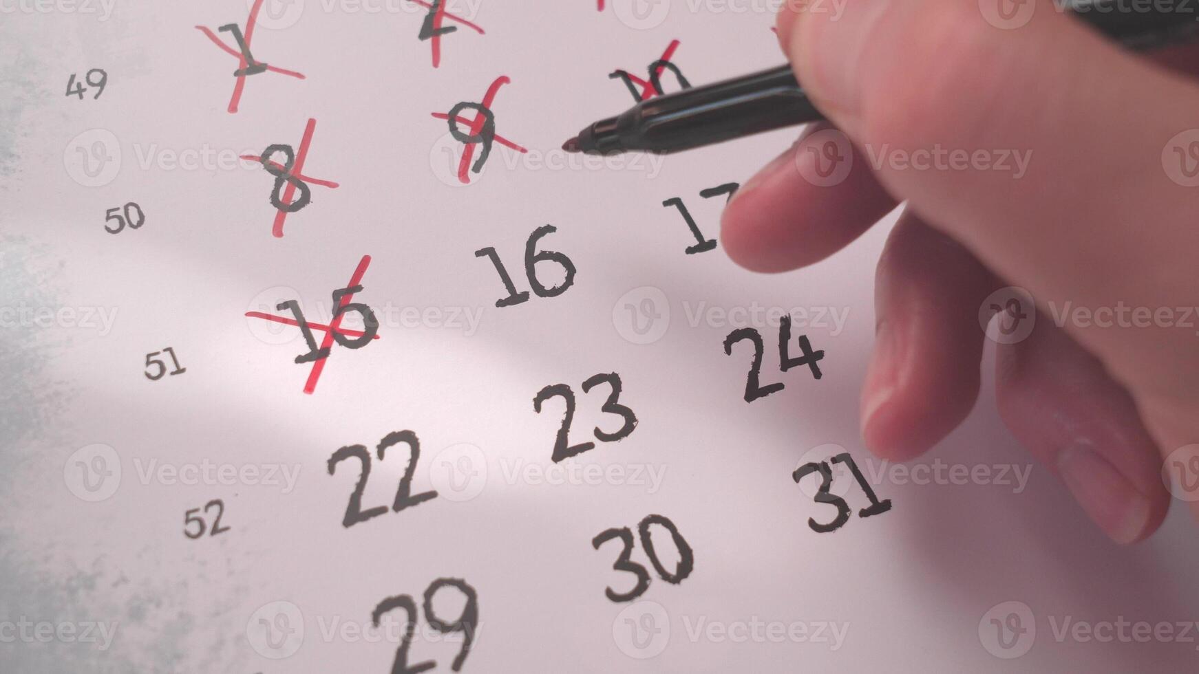 A structured calendar with marked dates emphasizes the importance of time management and organization photo