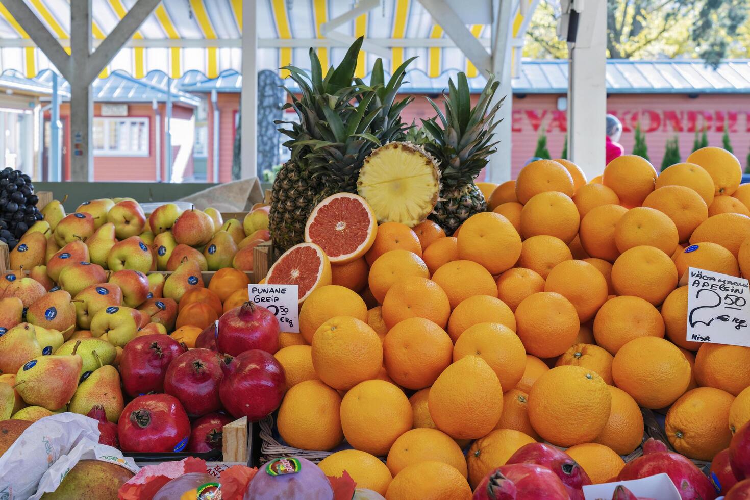 Tallinn, Estonia, October, 2024 Vibrant Display of Fresh Fruits at an Outdoor Market Stall photo