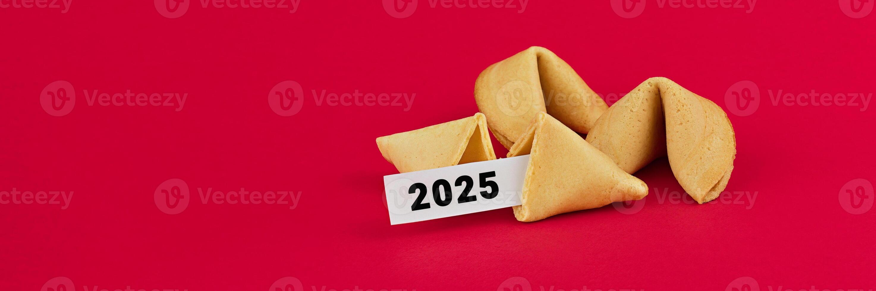 Fortune Cookies with a 2025 Prediction on a Red Background with Copy Space photo
