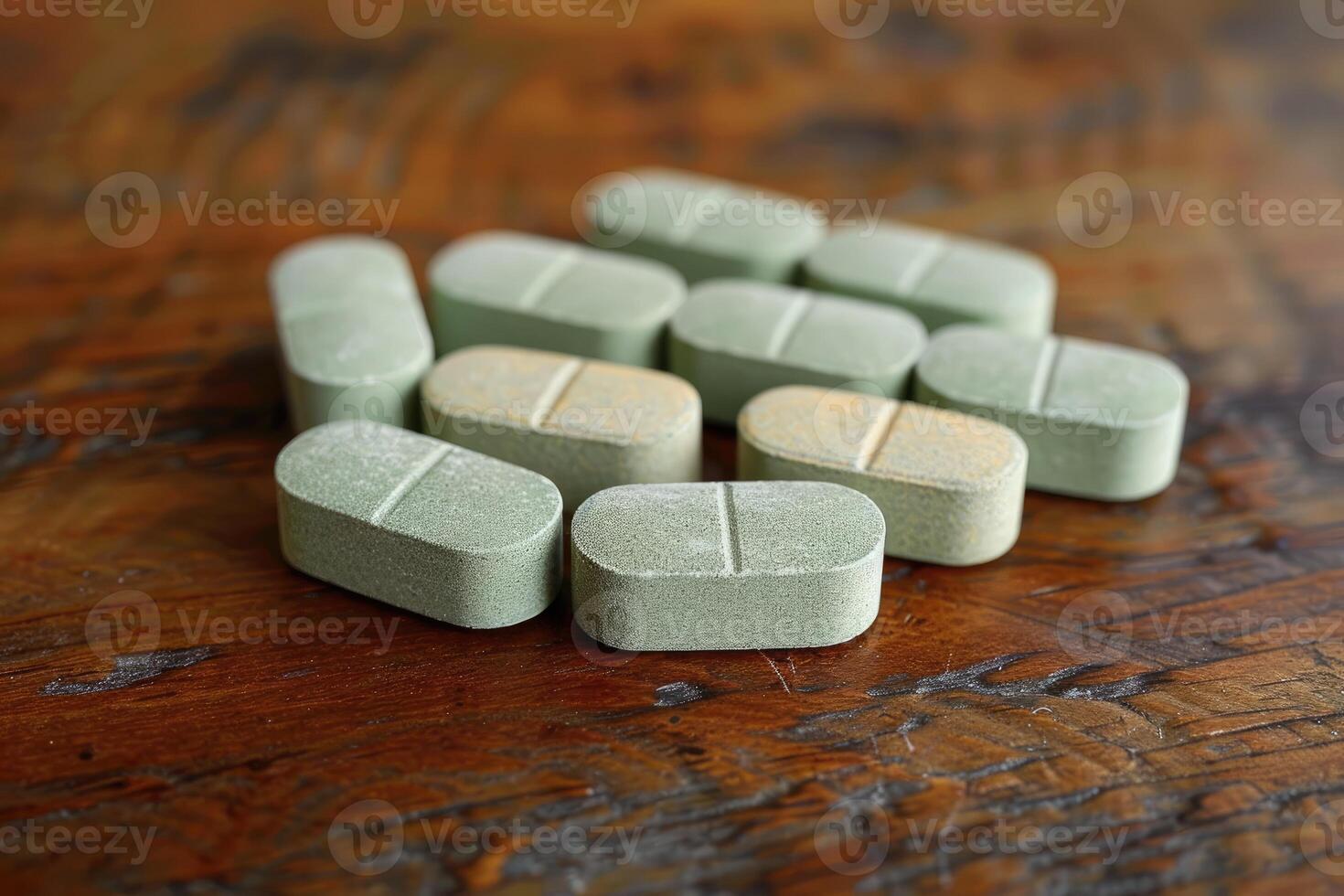 A Close-Up of Green Pills Scattered on a Wooden Table photo