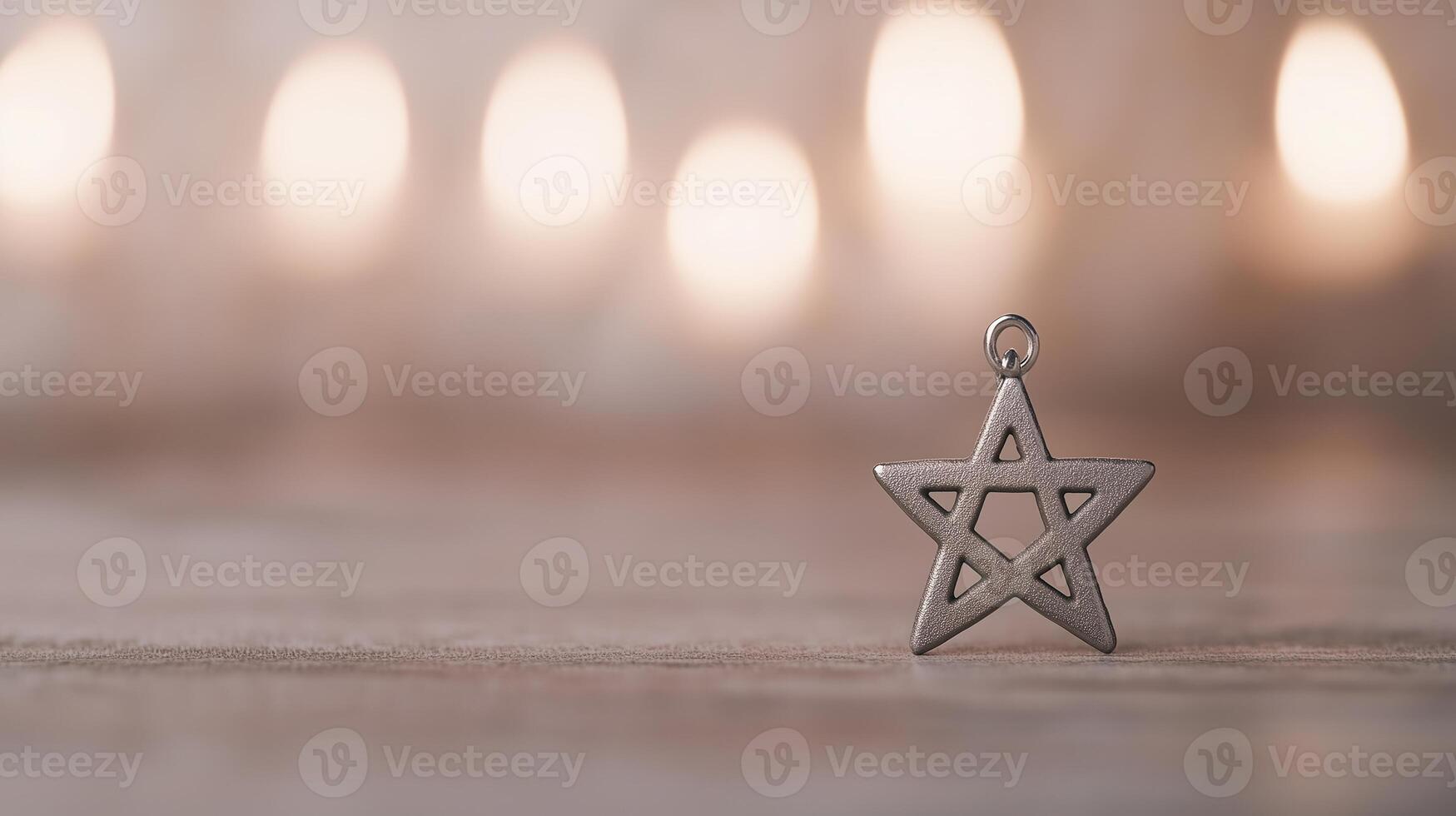 Silver Star of David Pendant on Blurred Candle Background Reflecting Hanukkah Symbolism and Jewish Heritage in Soft Focus photo