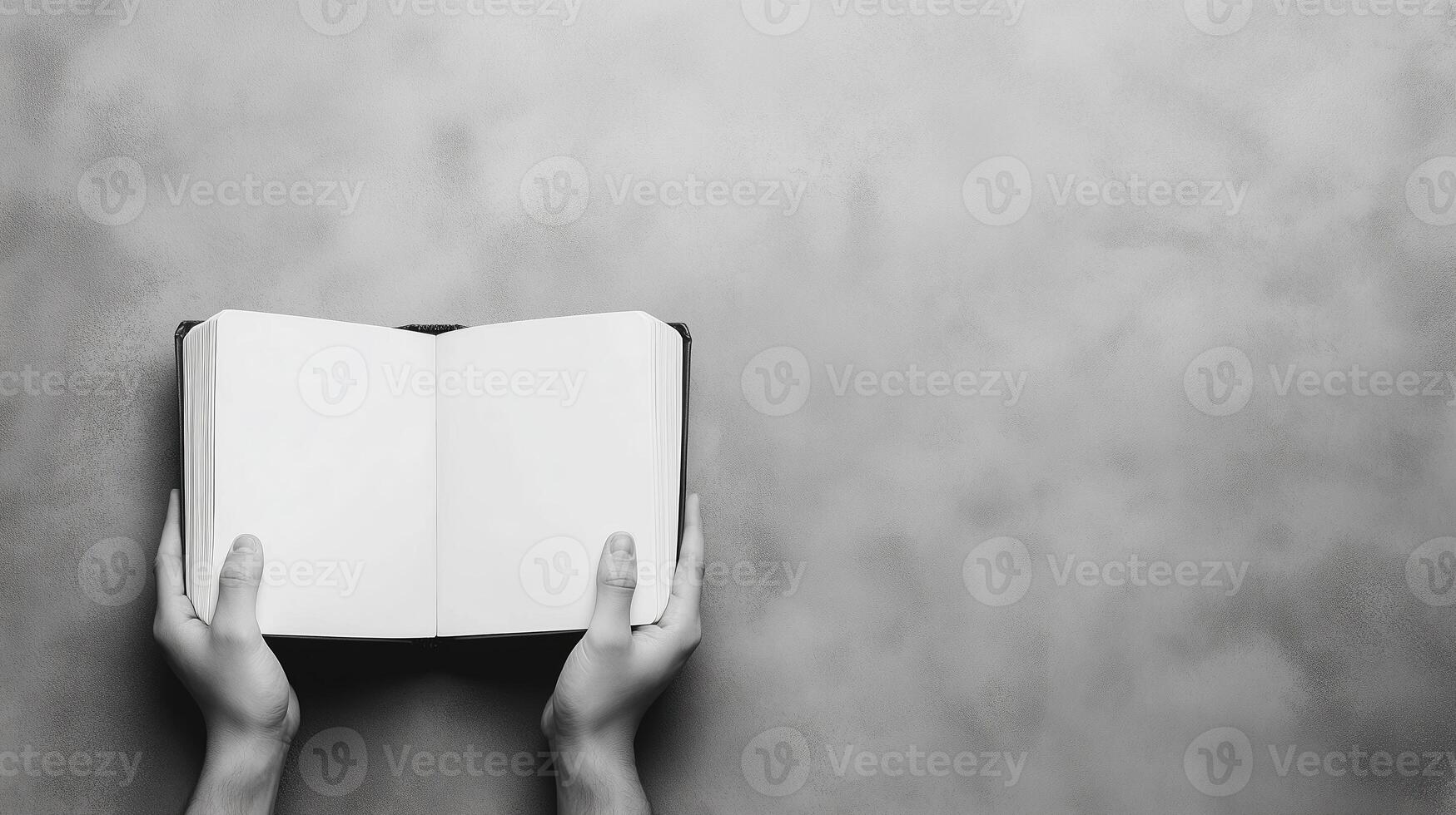Hands Holding Open Blank Book Against Gray Background Symbolizing Knowledge and Learning with Space for Text or Design in Minimalist Style photo
