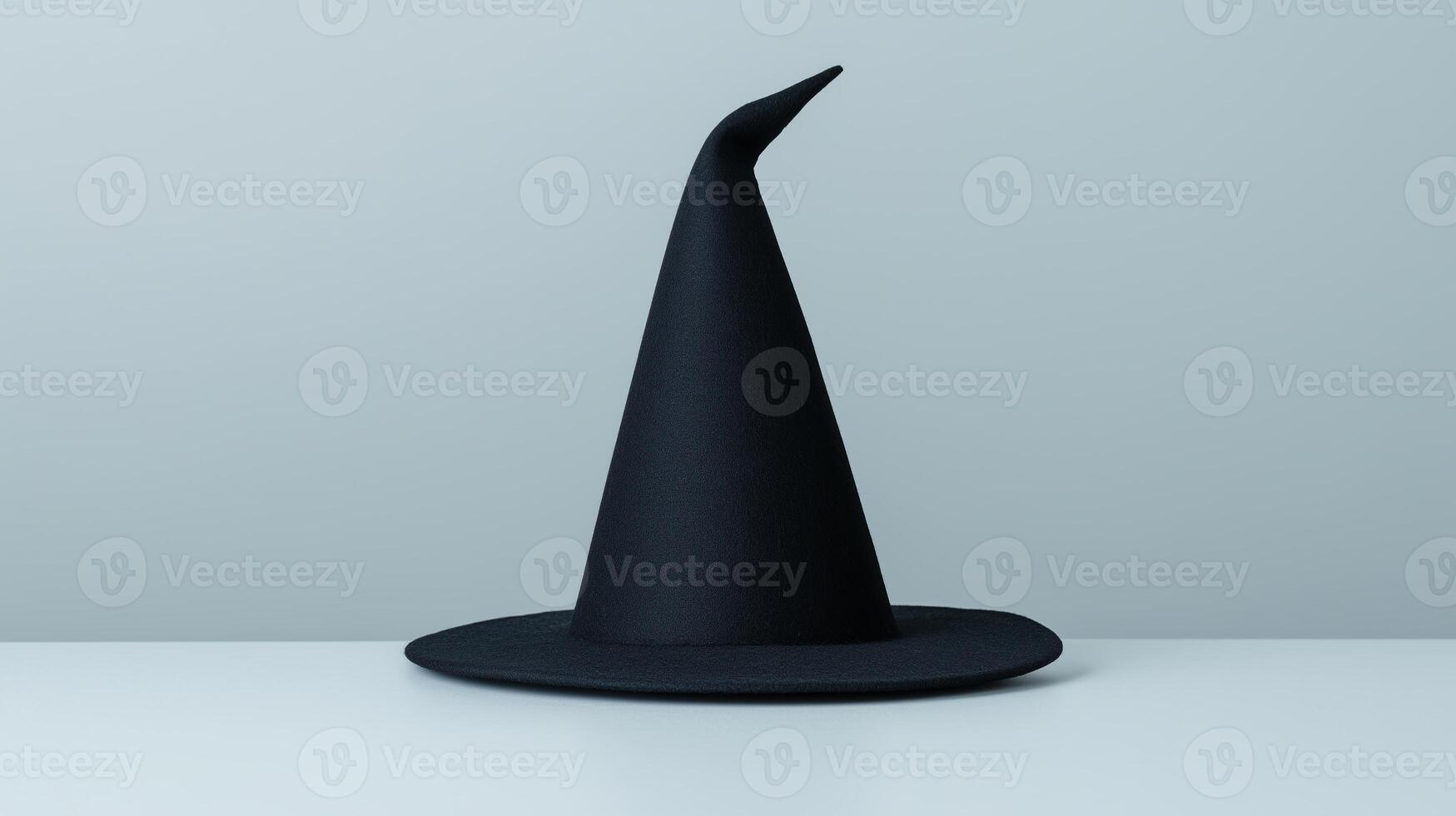 Black Witch Hat Isolated on White Background for Halloween Spooky Theme, Perfect for Decoration and Design Projects, Magic Costume Accessory, October Holiday Celebrations and Events photo