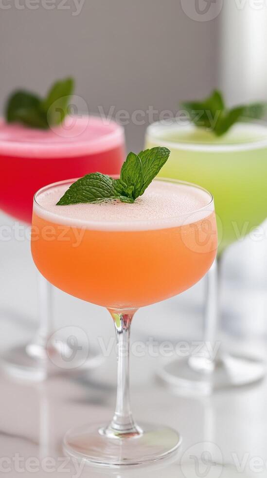 Colorful Cocktails With Mint Leaves in Elegant Glasses on Marble Table Perfect for Parties and Celebrations photo