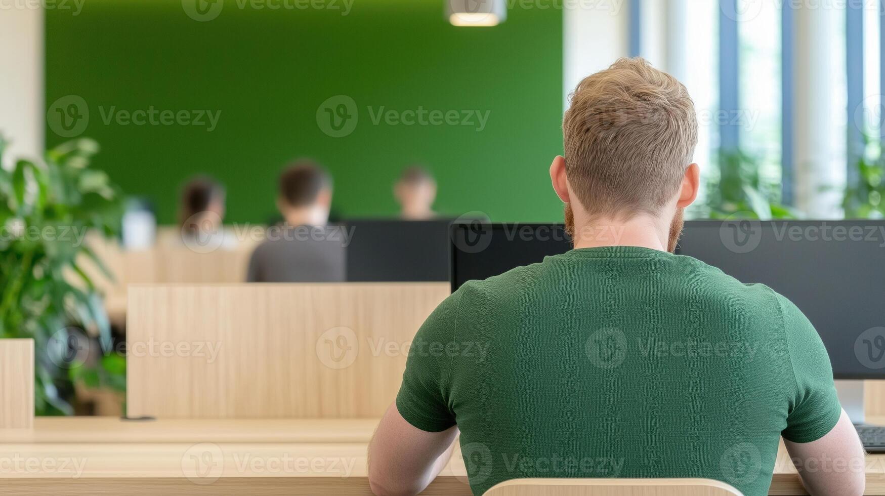 Modern Open Plan Office with Natural Earth Tone Furnishings and Green Accents, Featuring Focused Workers and Abundant Natural Light, Ideal for Productivity and Contemporary Workspace Design photo