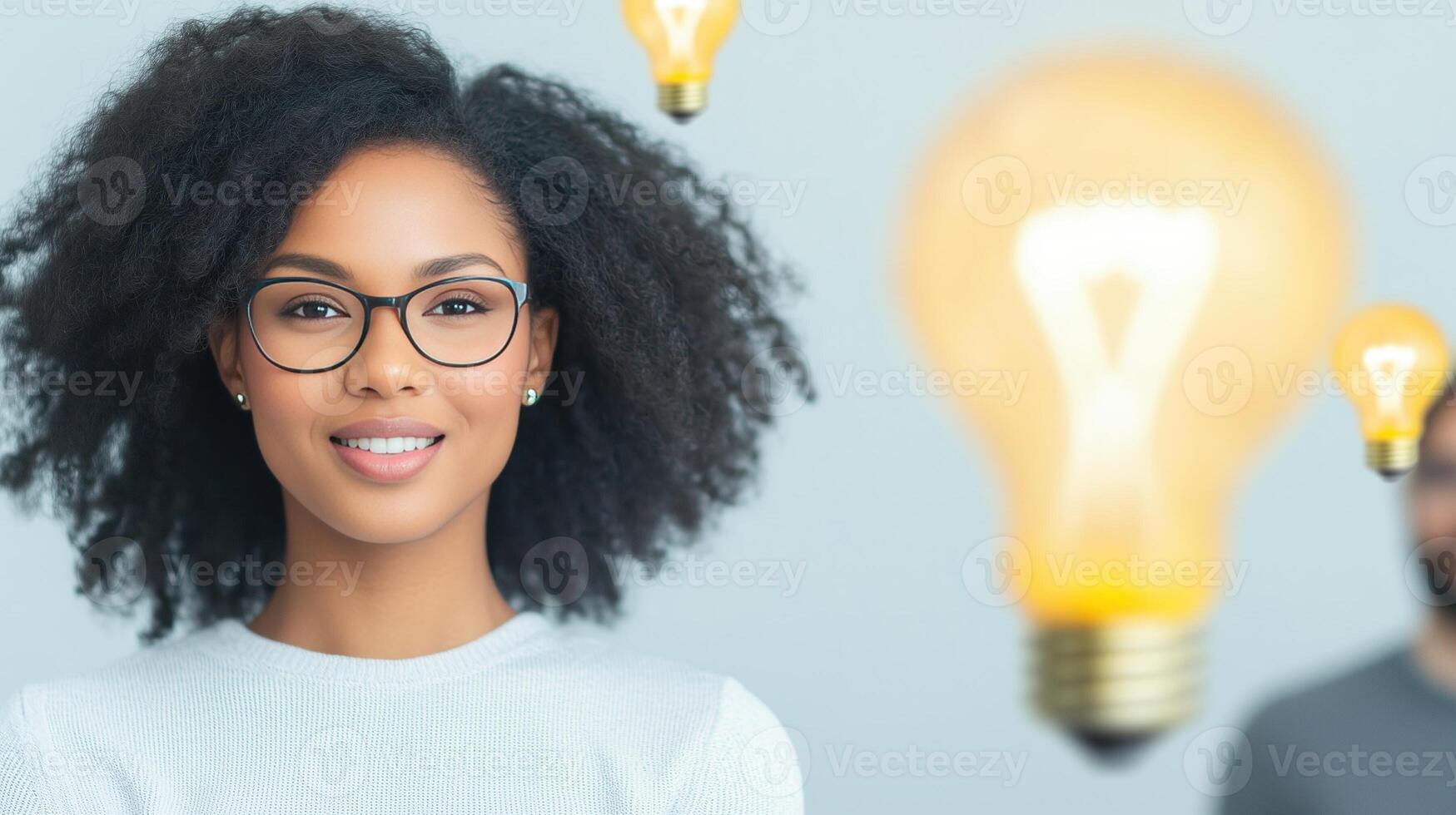 Team Brainstorming Session with Hanging Light Bulbs and Smiling Professional Woman in Focus photo