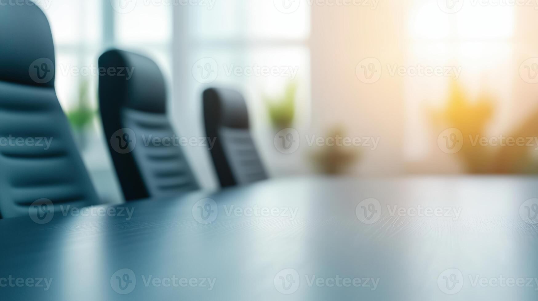 Modern Corporate Boardroom With Long Table And Leather Chairs In Bright Office Setting With Sunlight photo