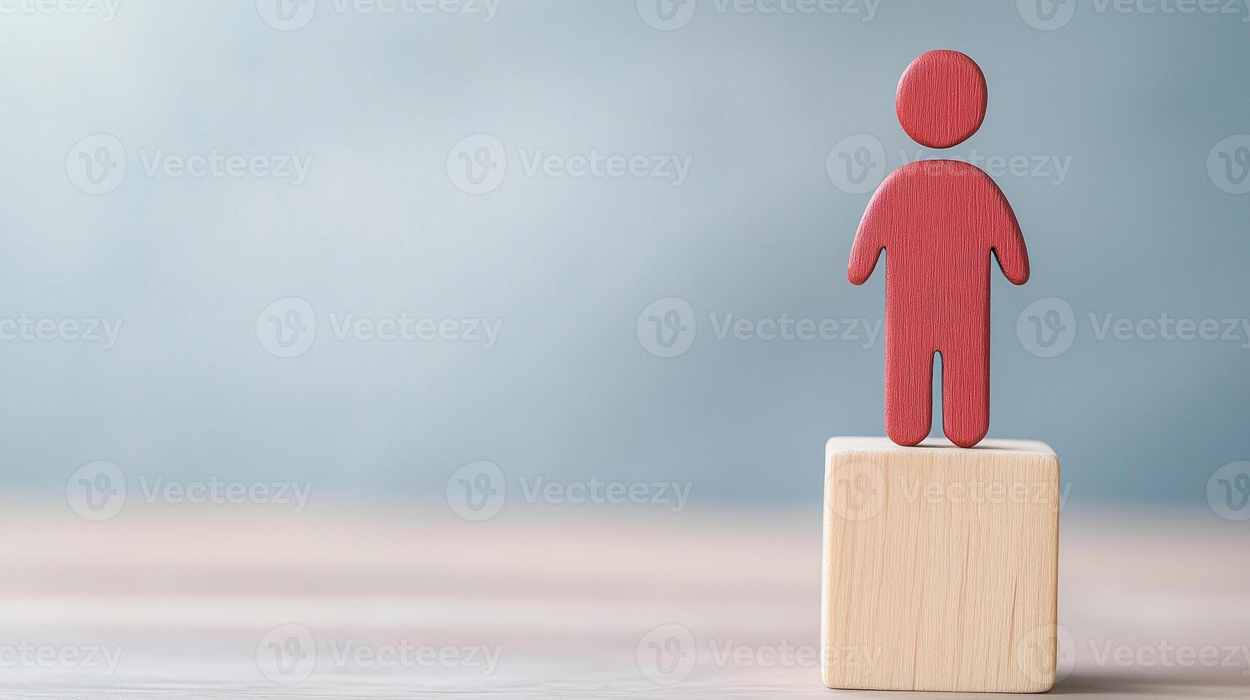 Inspirational Coaching Concept with Red Figure on Wooden Block Against Soft Blue Background for Motivational Growth and Leadership Themes in Modern Business Imagery photo