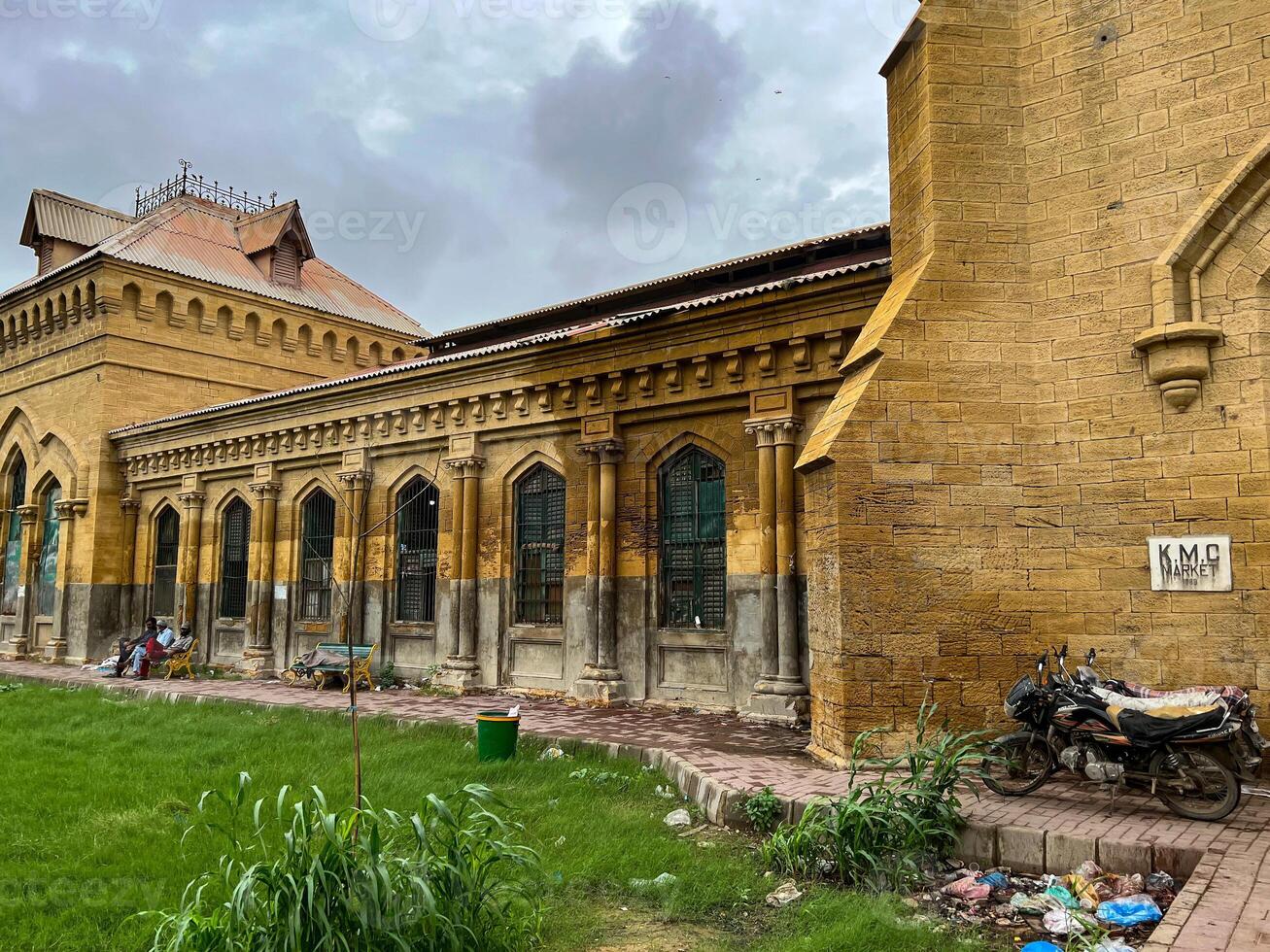 Bikes by the walls of the Empress Market in Karachi, Pakistan photo