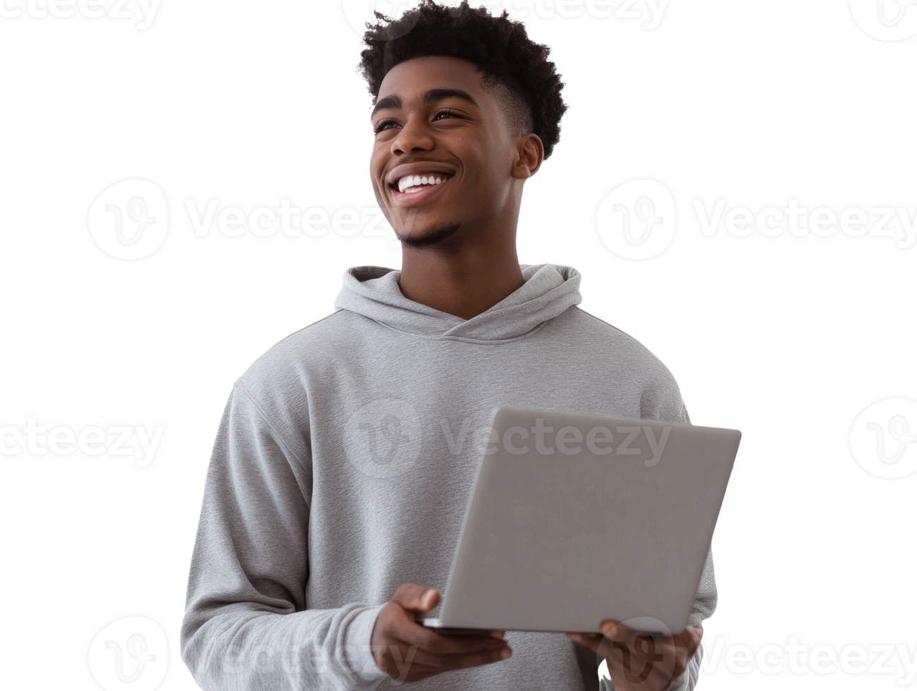 Young man smiling while holding a laptop indoors png