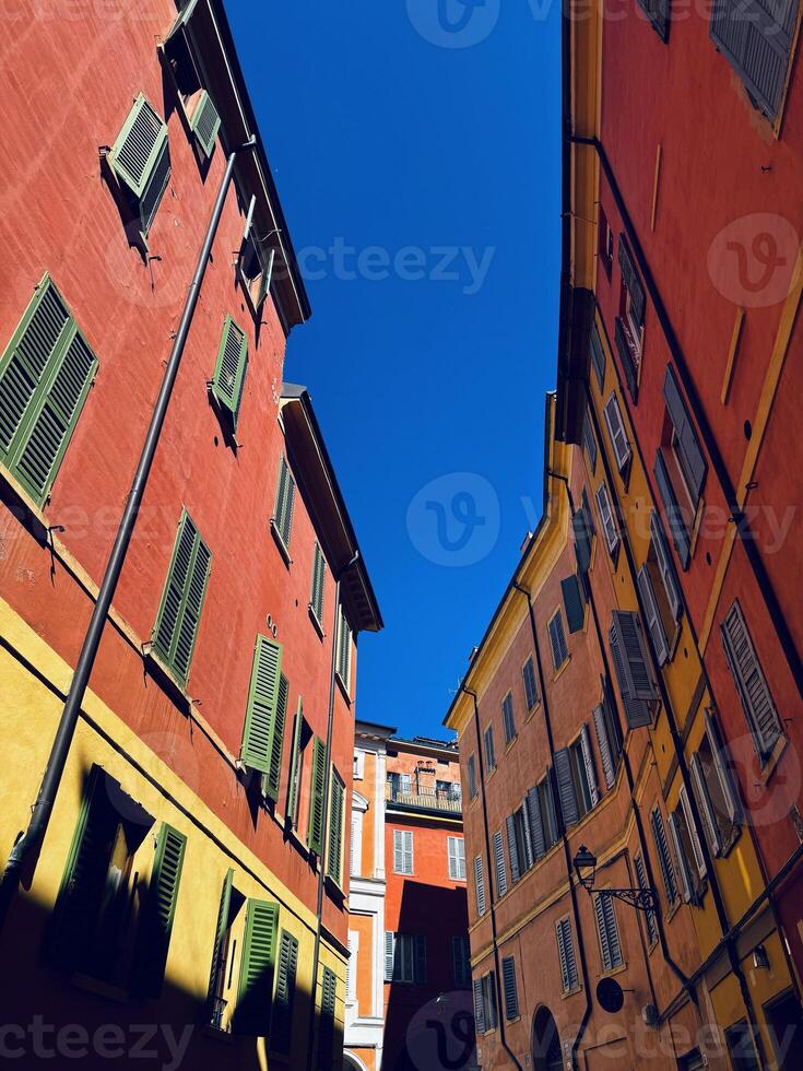 A Charming and Inviting Narrow Street That Is Surrounded by Beautiful Colorful Buildings photo