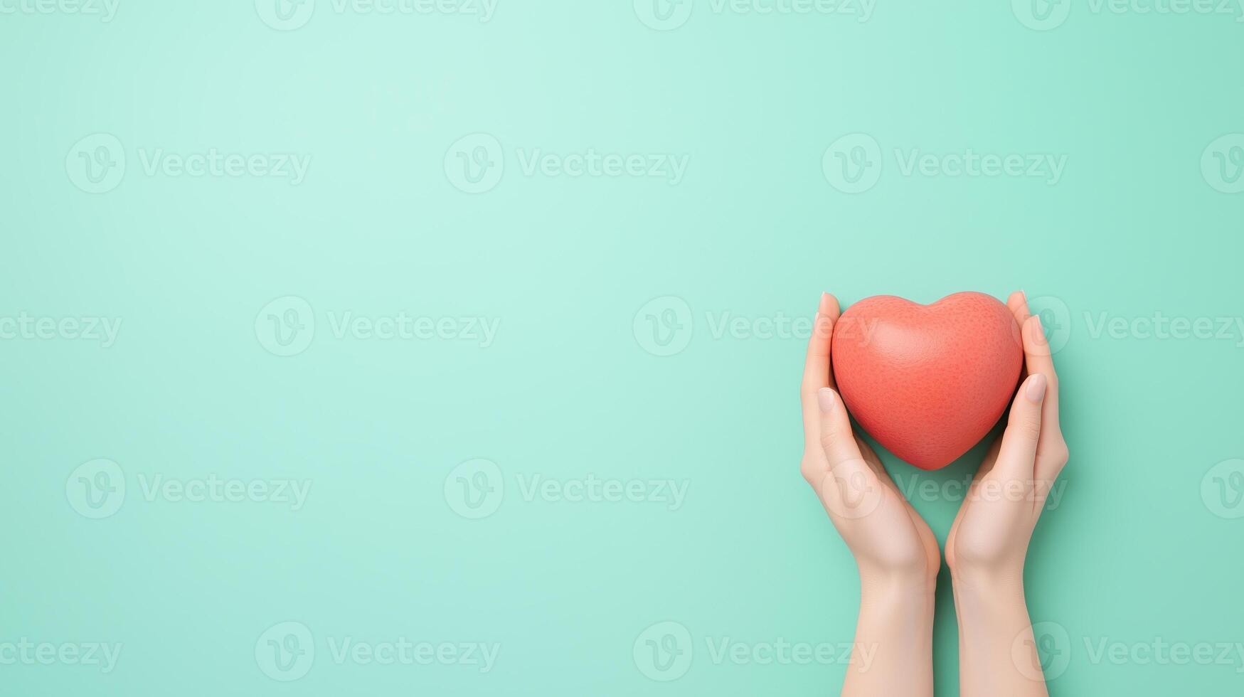 Hands gently holding a red heart-shaped object on a turquoise background. Minimalist concept of love, care, and support for design and print photo