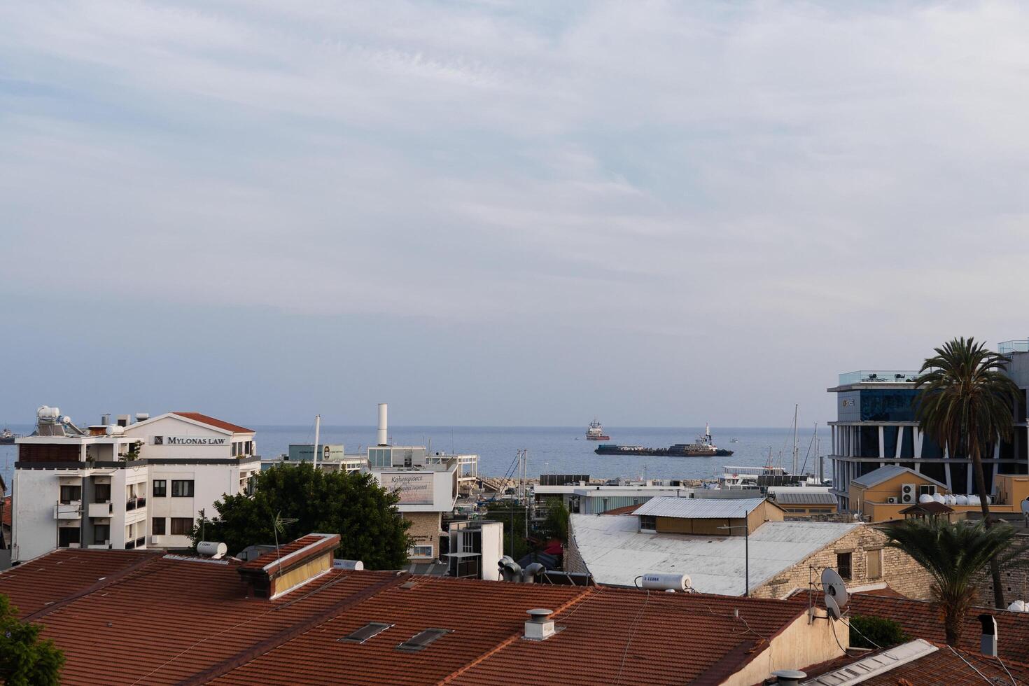 Cyprus,Paphos - May 30, 2023. In the distance, you can see a container ship entering the port of Paphos in the Cyprus Bay photo
