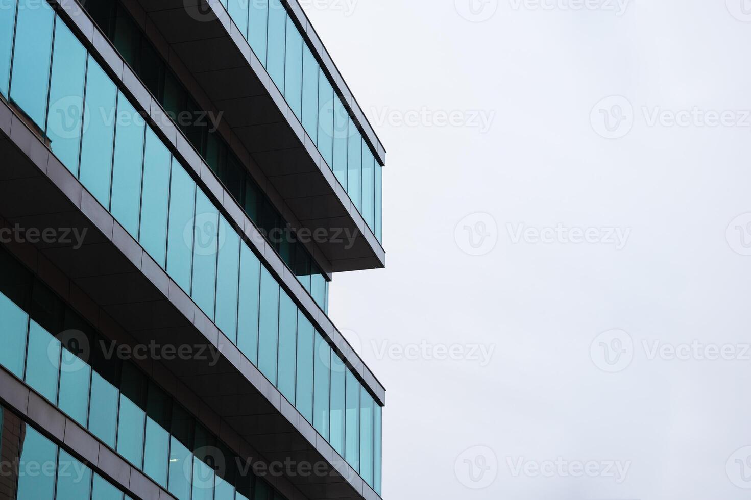 New blue glass building architecture on blue sky background,Low angle architectural exterior view of modern, copy space for text photo