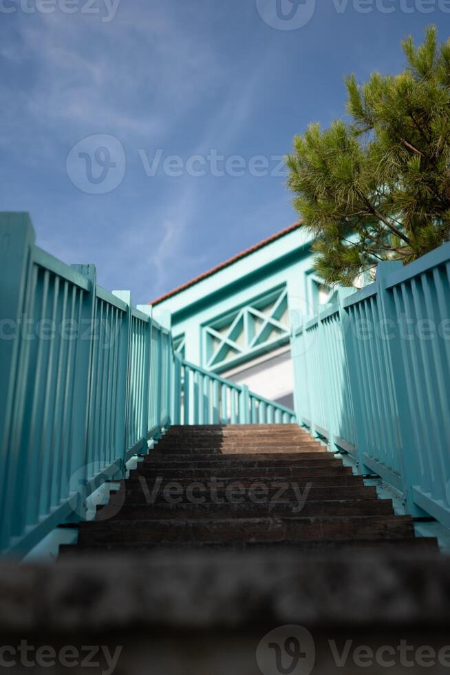 Modern blue stair up to the rooftop photo