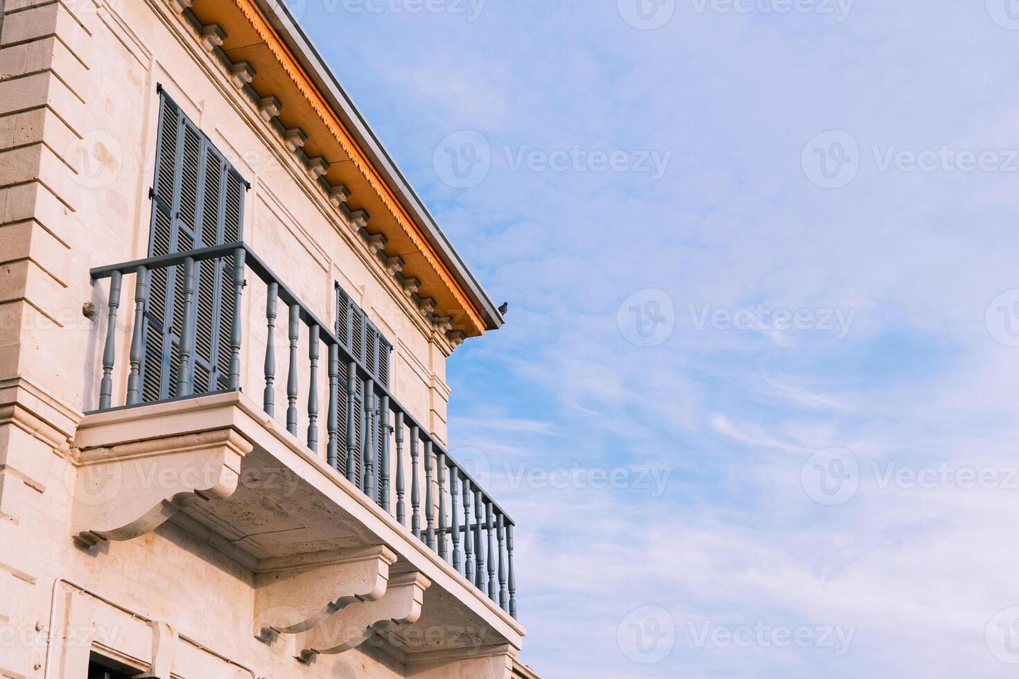 Cute and bohemian blue old balcony facade, wood windows in Nicosia photo