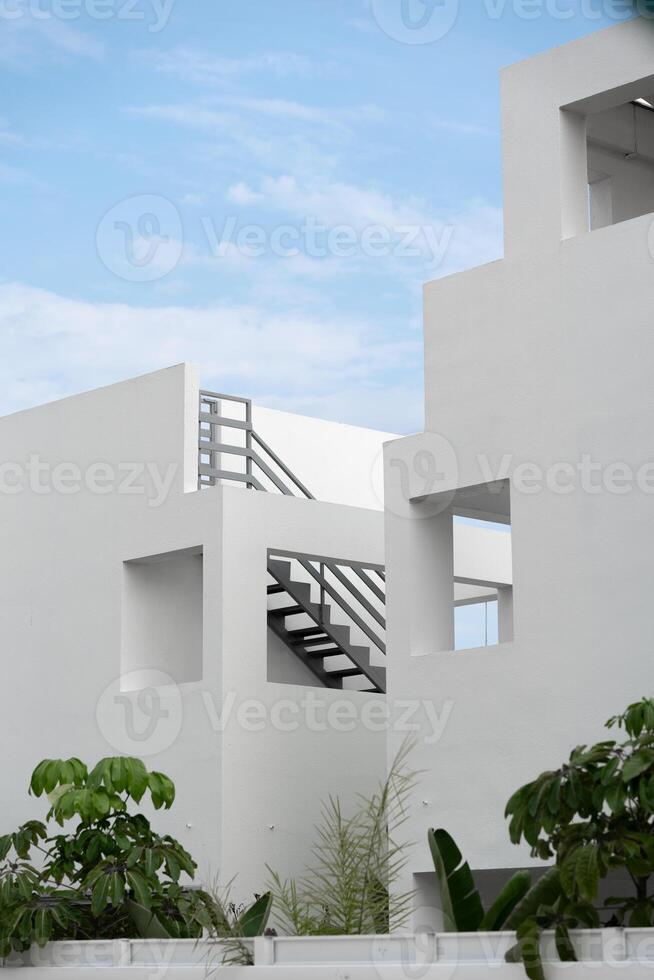 Generic geometric minimalist white architecture on a clear sunny day. photo