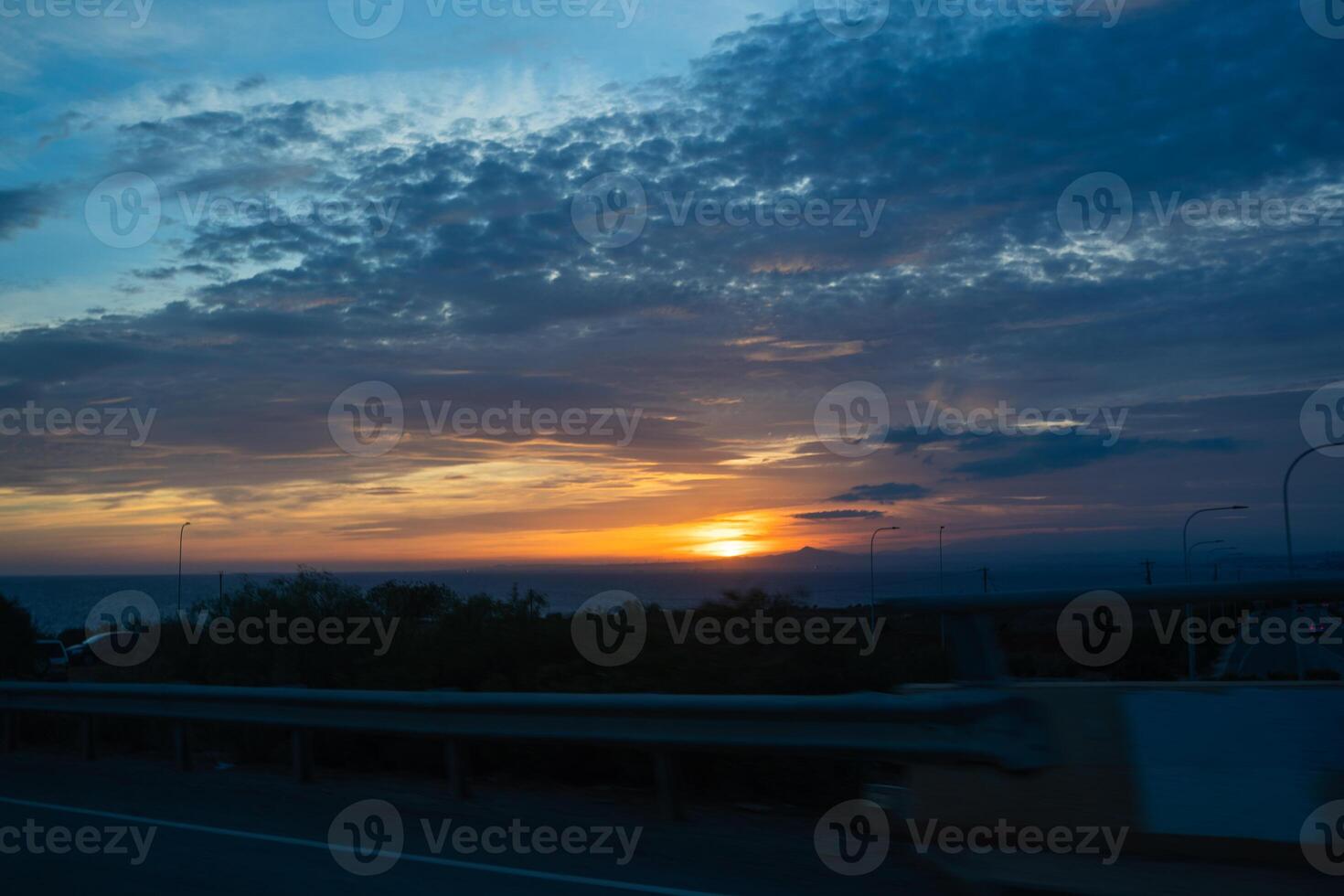 movement of stars in the night sky with the view of mountains photo
