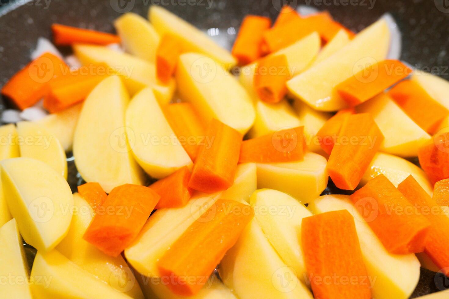 sliced vegetables prepared for cooking. potato, carrot photo
