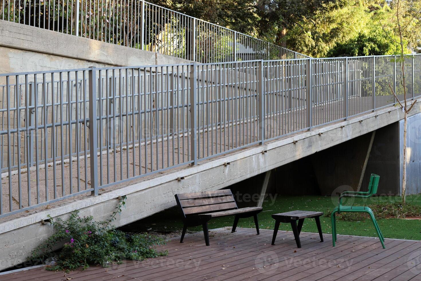 bench for rest in the city park photo