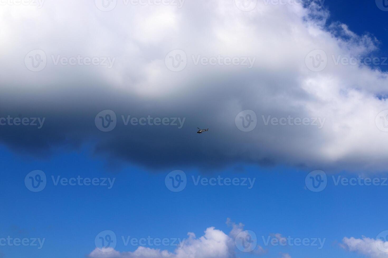 white clouds are floating across the sky photo