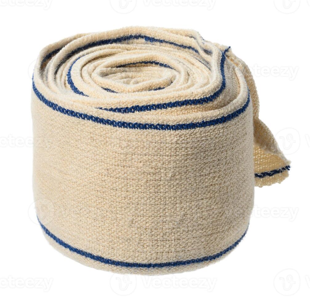 Roll of textile medical elastic bandage for limbs photo