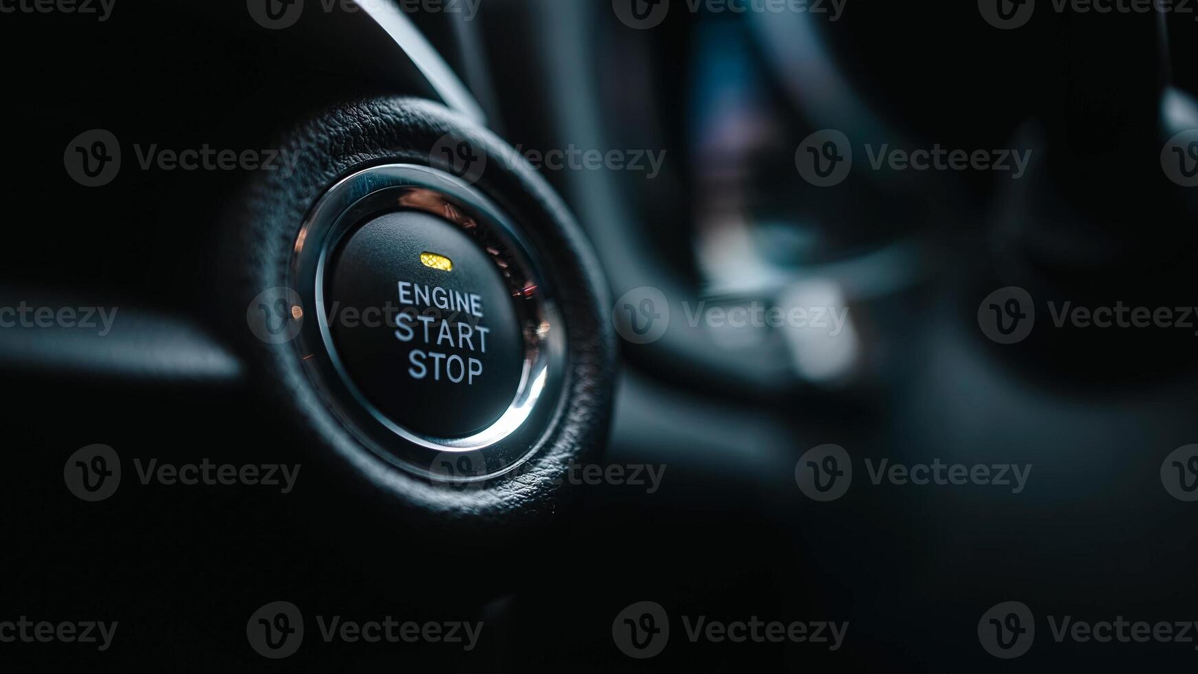 Close-up of modern car's engine start and stop button, offering convenience, keyless ignition. Press the button to start or stop the engine, a feature in many modern vehicles. Banner, ads, copy space photo