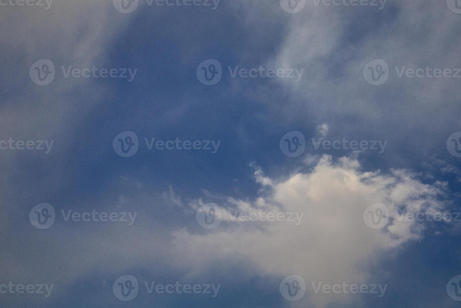 Scattered Clouds in a Blue Expanse photo
