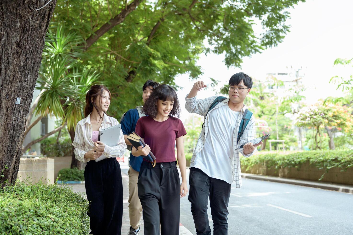 Students Enjoying a Sunny Day While Walking on Campus in the Afternoon photo