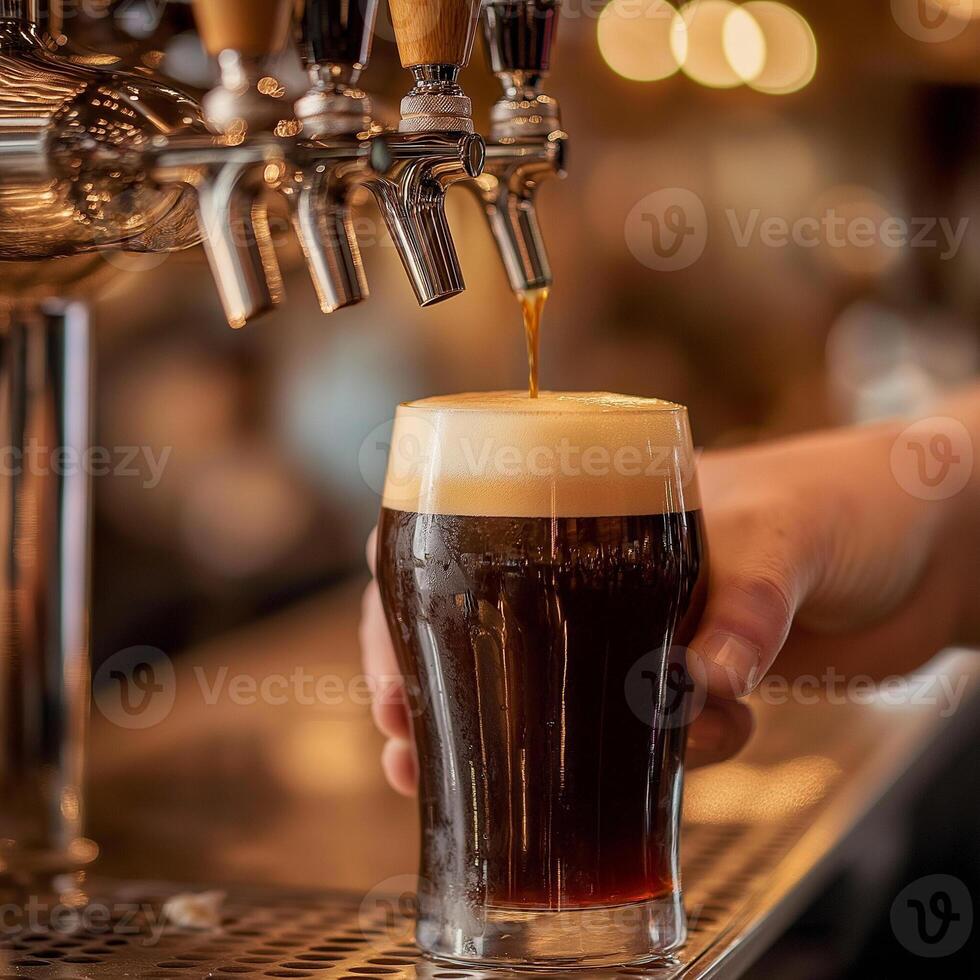 Bartender pouring stout beer with rich head and caramel hues photo