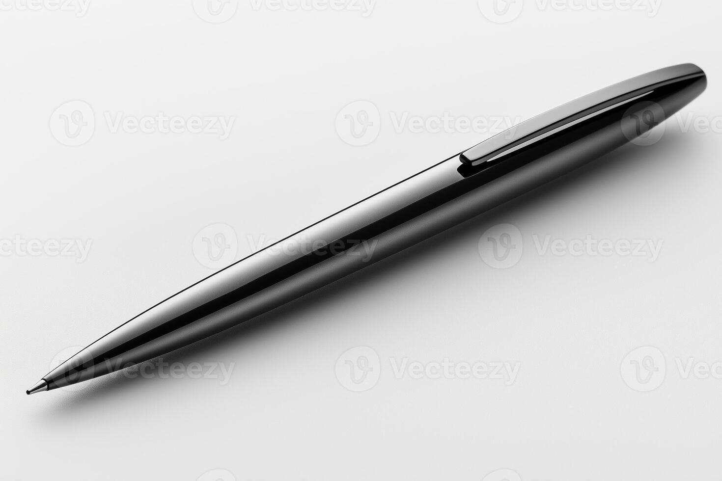 Sleek Metallic Ballpoint Pen Resting On Minimalist Desk photo