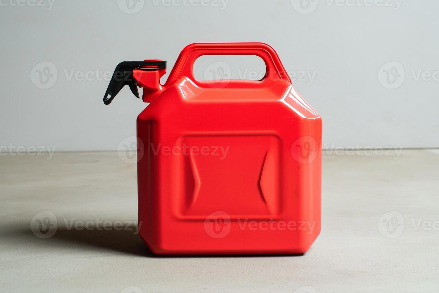Modern red gasoline canister with spout and ergonomic molded handles photo
