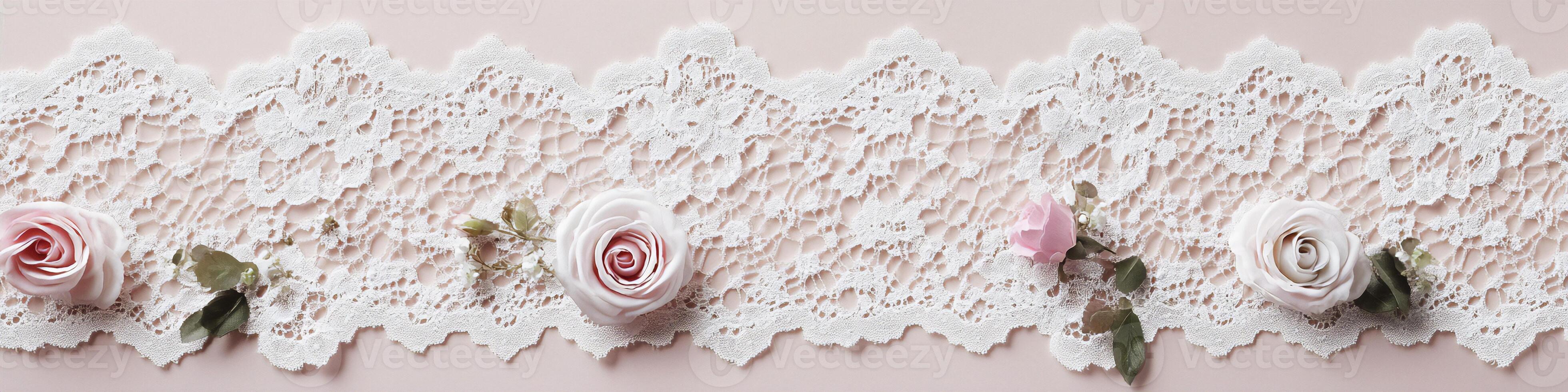 Delicate white lace banner with blush roses on a soft pastel pink background photo
