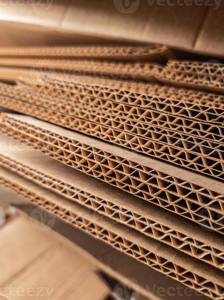 Close-up view of stacked corrugated cardboard layers, showcasing the intricate wave structure and texture, ideal for concepts like packaging, recycling, industry, and material design photo