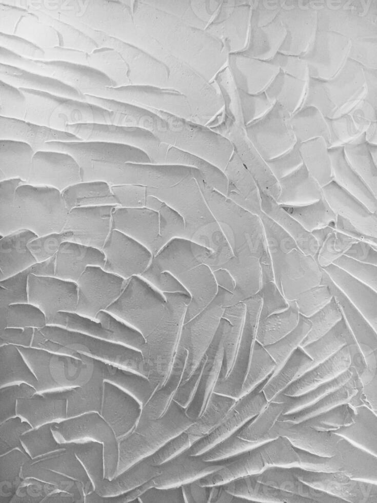 Textured white plaster wall with abstract patterns, close-up, artistic design, interior decoration, perfect for creative backgrounds. photo