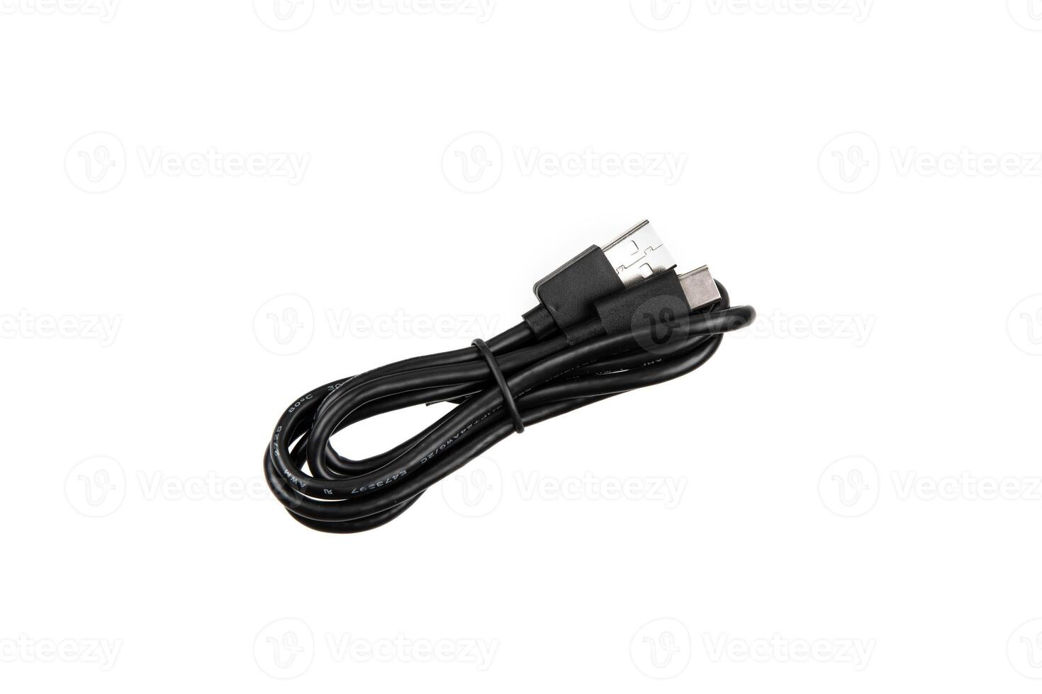 Black USB cable with two connectors, neatly coiled and secured with a strap, isolated on a white background. photo