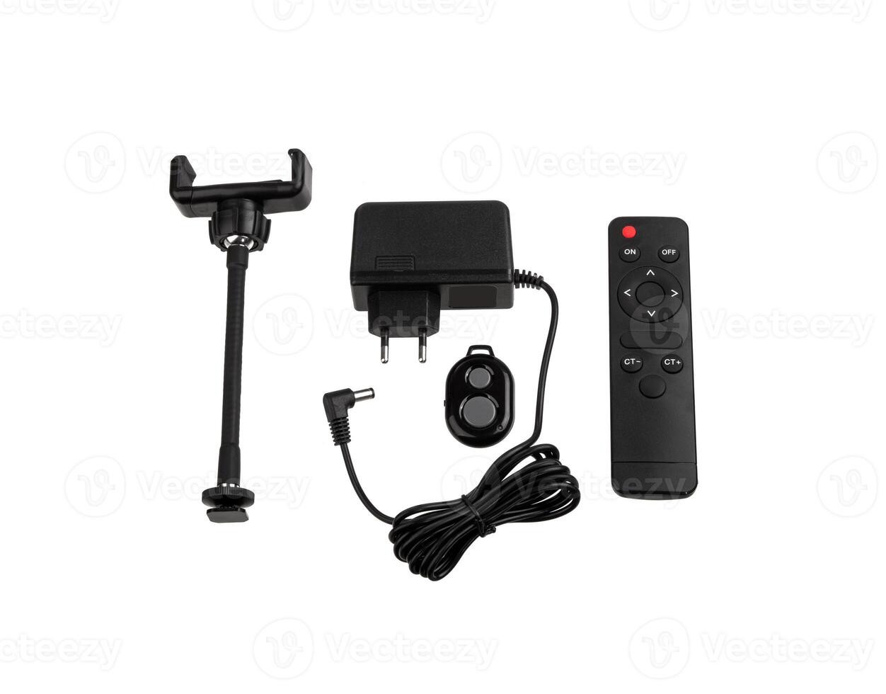 et of electronic accessories including a phone holder, power adapter, remote control, and wired remote shutter, useful for photography and videography setups, isolated on a white back photo