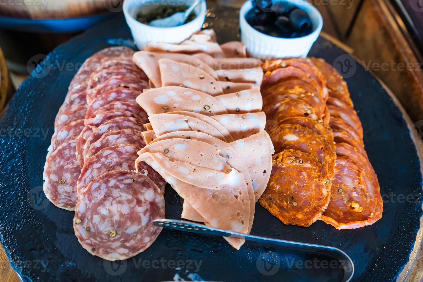 Delicious Assorted Cold Cuts Platter with Salami, Mortadella, and Chorizo photo