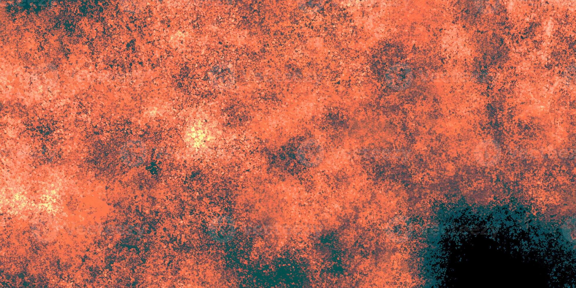 A textured abstract background in vibrant orange tones with black speckled patterns, ideal for creative designs. photo