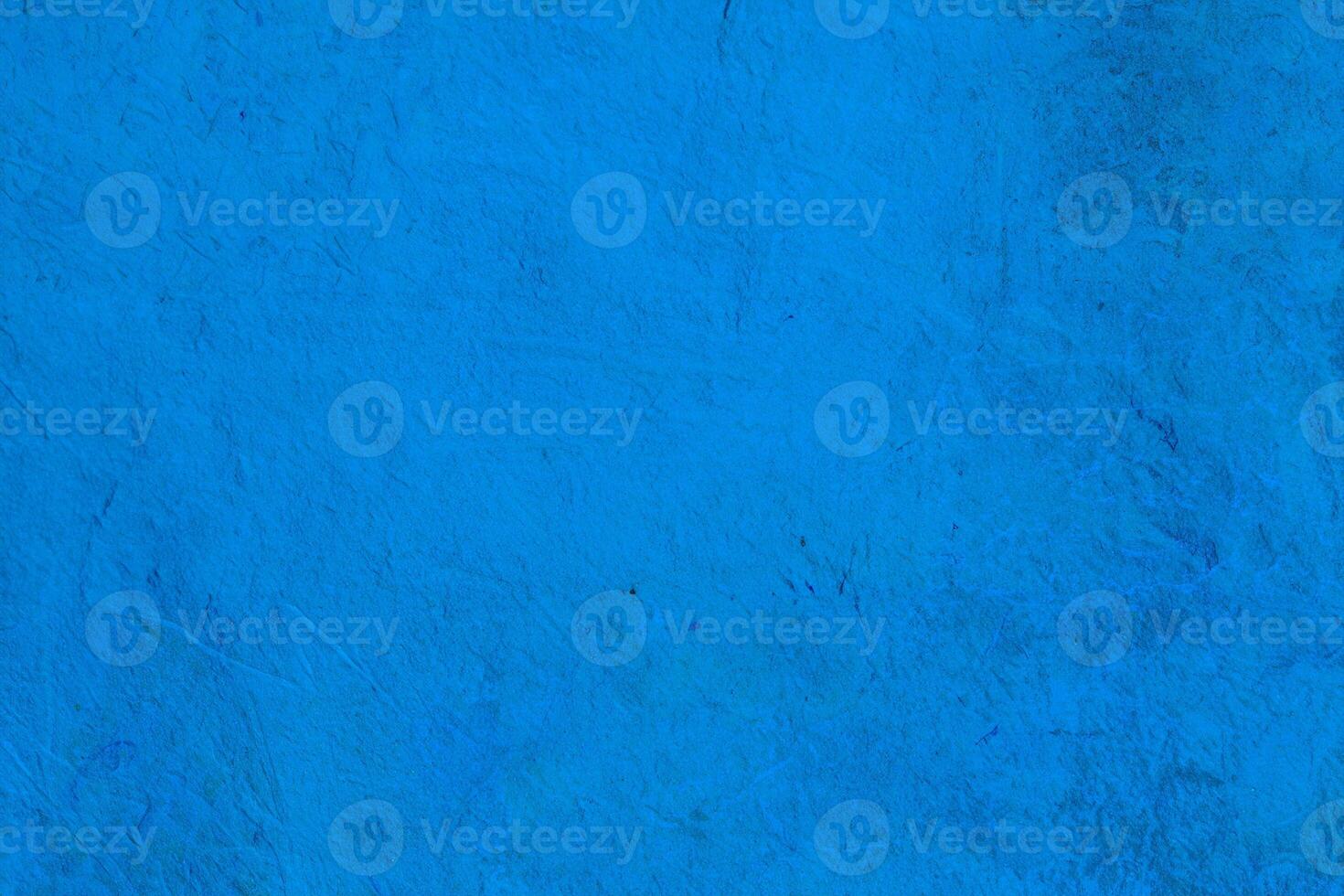 Bright blue texture with natural rough patterns and subtle imperfections, ideal for creative backgrounds or designs. photo