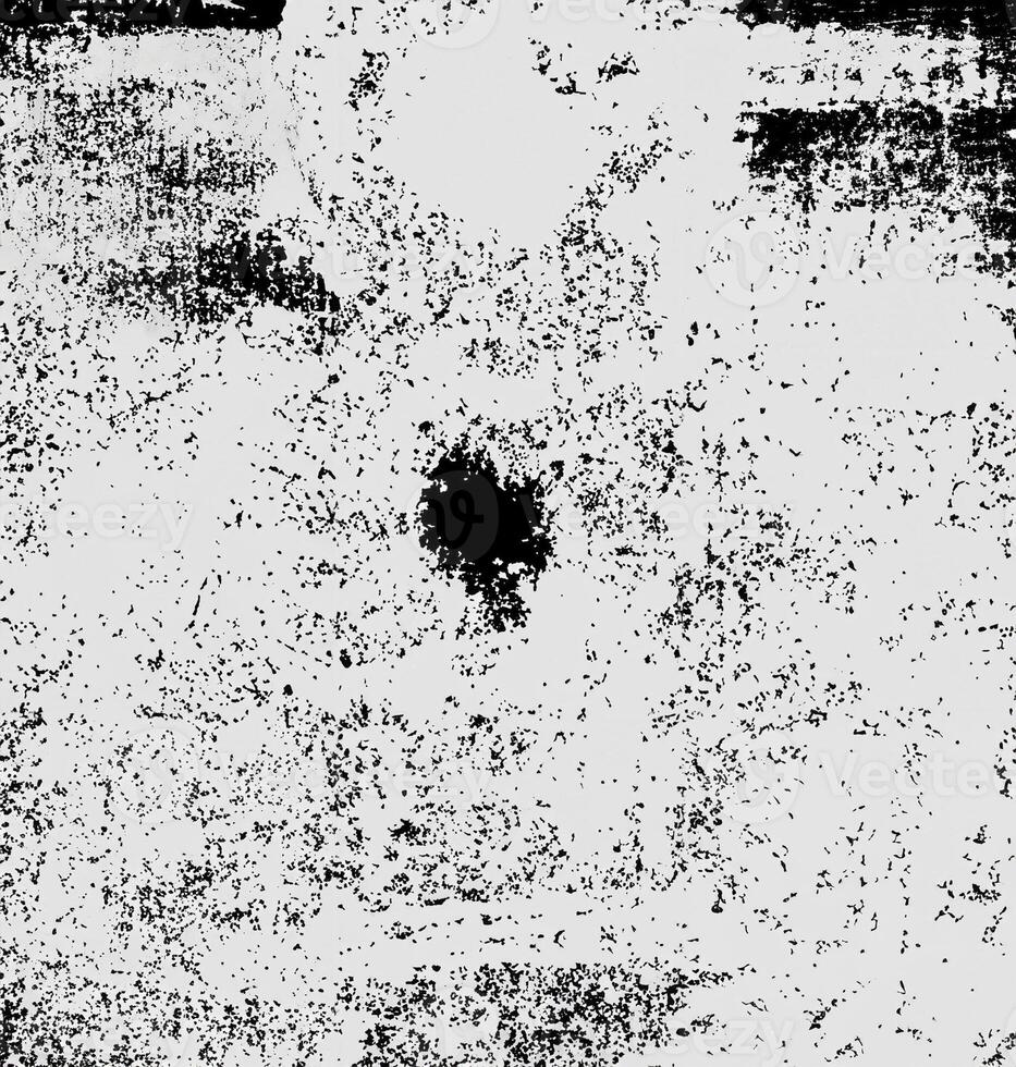 Monochrome grunge texture with speckled and distressed patterns, ideal for backgrounds, overlays, or artistic projects. photo
