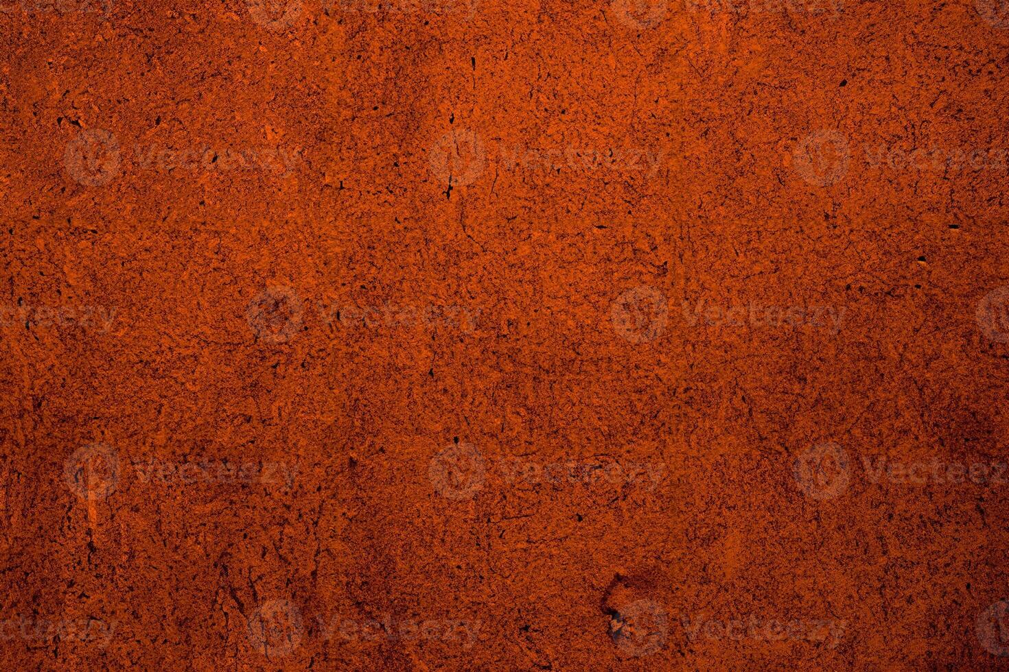A rustic orange wall with a rough, fibrous texture, perfect for natural or vintage design backgrounds. photo
