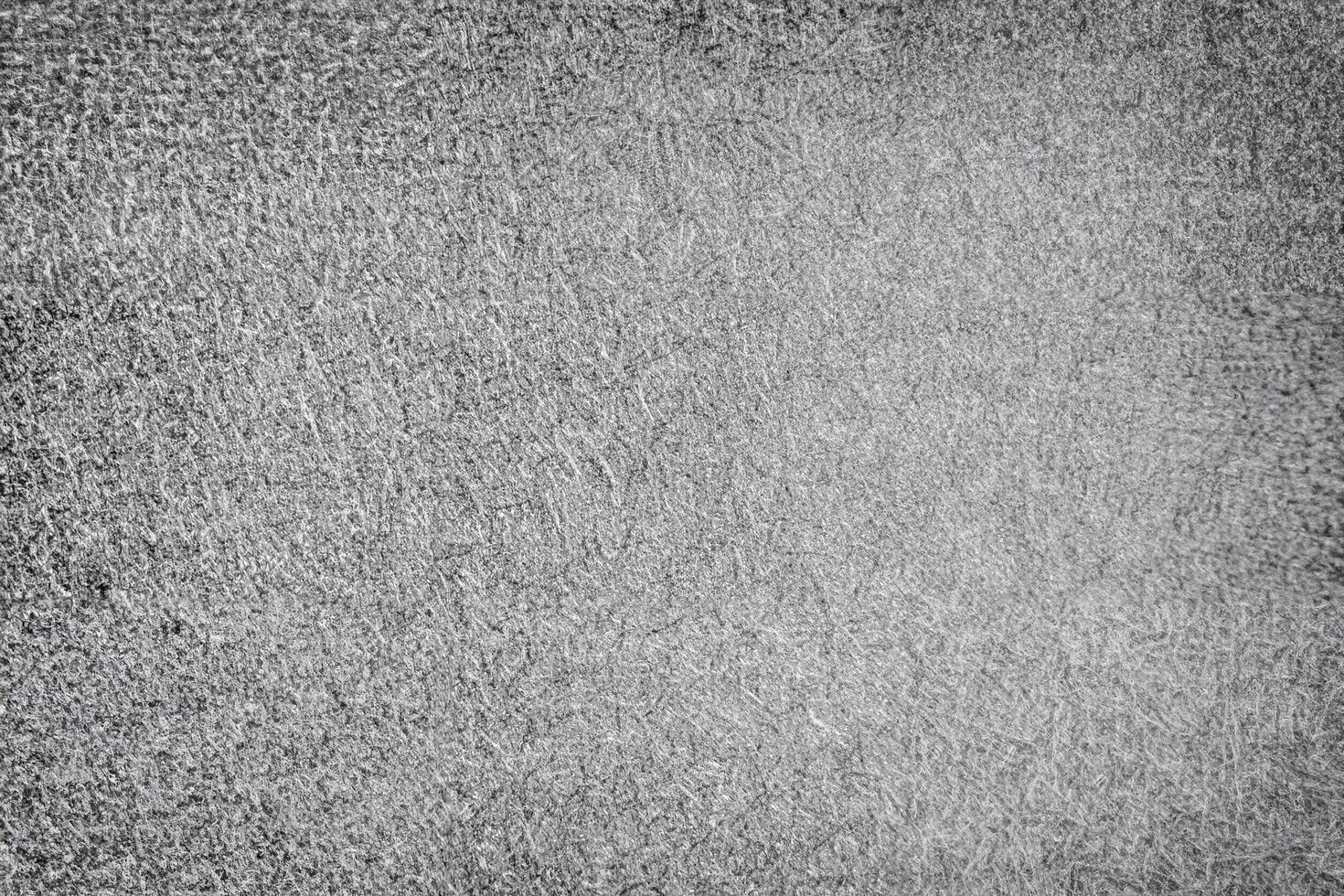 A high-contrast gray background with a fibrous, rough texture, perfect for industrial, abstract, or minimalist designs. photo