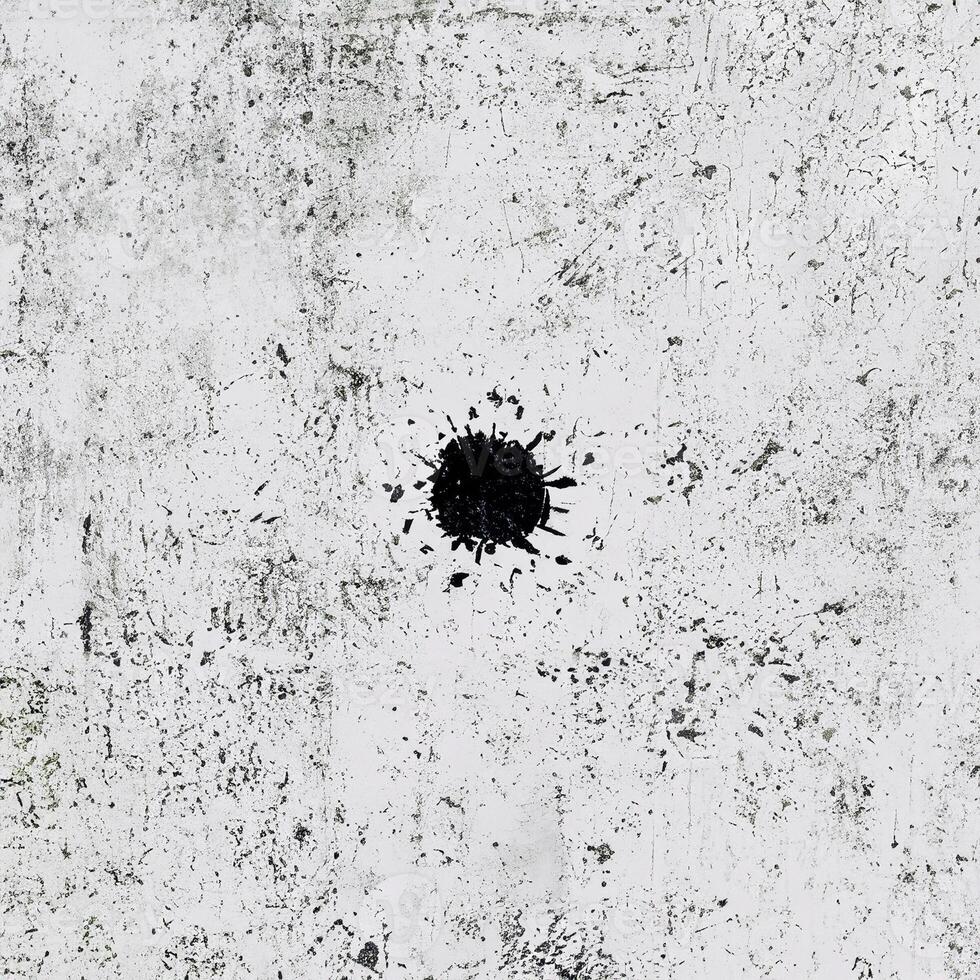 High-contrast white grunge texture with black scratches and speckles, perfect for backgrounds and creative overlays. photo