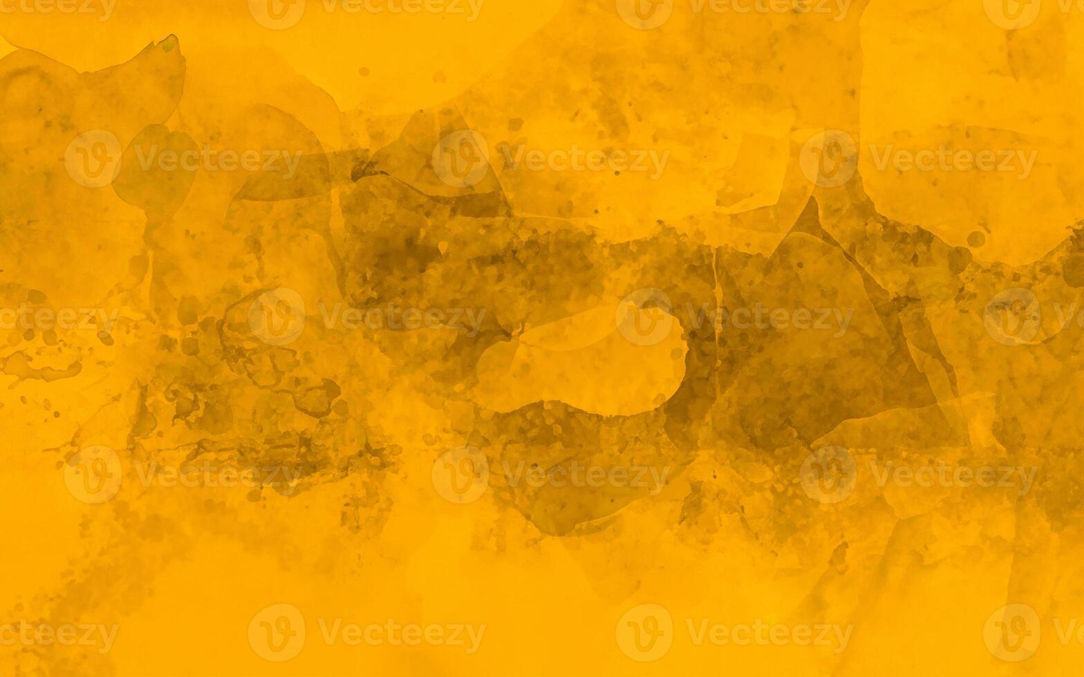 Bright yellow watercolor abstract background with layered textures and artistic splatter effects. photo