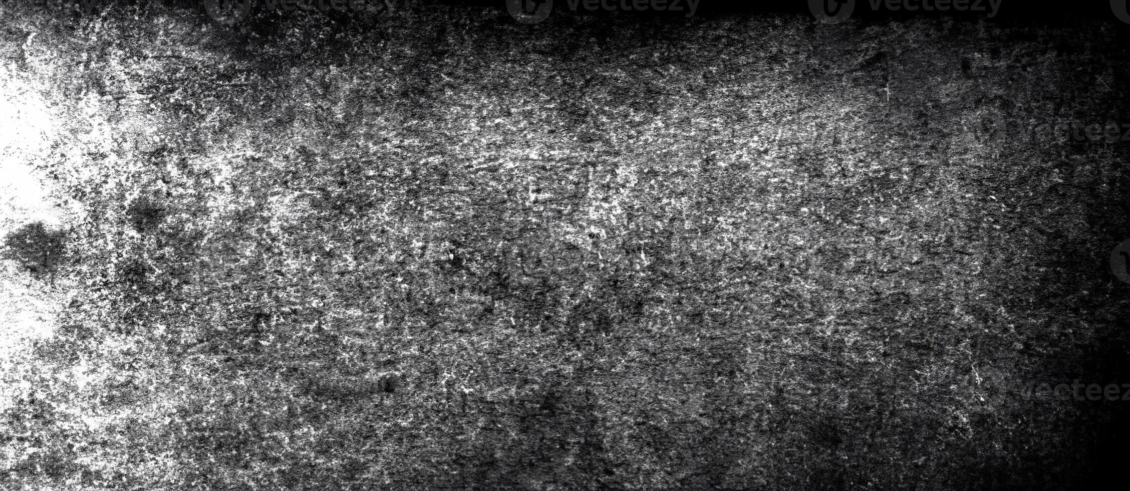 Abstract dark textured surface with subtle scratches, stains, and high contrast details. photo