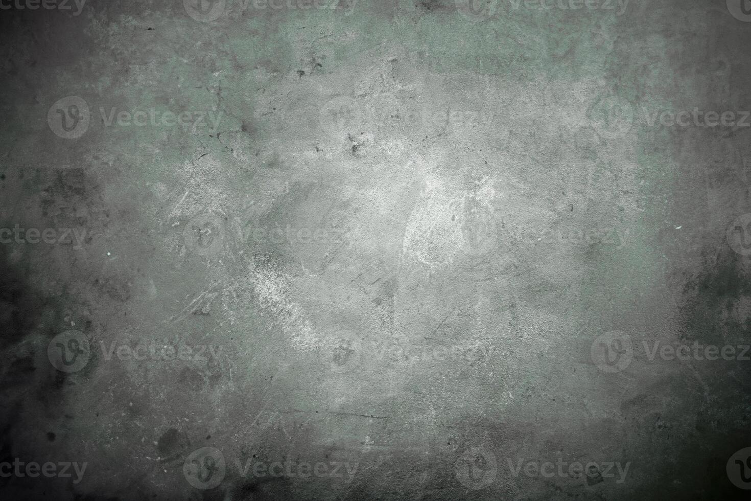 Soft, green-toned grunge background with subtle texture, concrete surface patterns, and faded, weathered appearance. photo